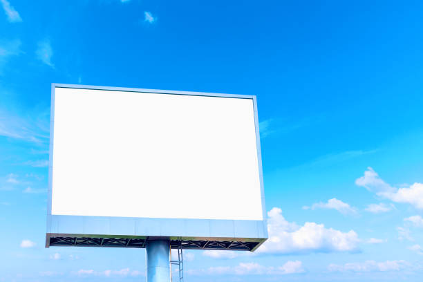 istock Blank billboard mockup with white screen against clouds and blue sky background. Copy space banner for advertisement. Business Concept. 1172220776