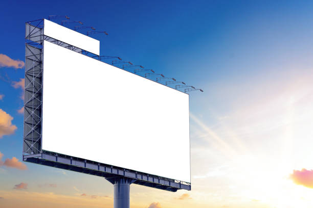 istock Blank billboard mockup with white screen against clouds and sunset with sunlight background. Copy space banner for advertisement. Business Concept. 1172221267