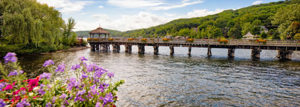 Panoramic view of North Hatley's promenade pier and gazebo in Eastern townships Quebec Panoramic view of North Hatley's promenade pier and gazebo in Eastern townships Quebec with potted flowers in the foreground. sherbrooke quebec stock pictures, royalty-free photos & images
