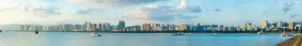 Sanya town evening cityscape, view from Phoenix island on Hainan Island in China