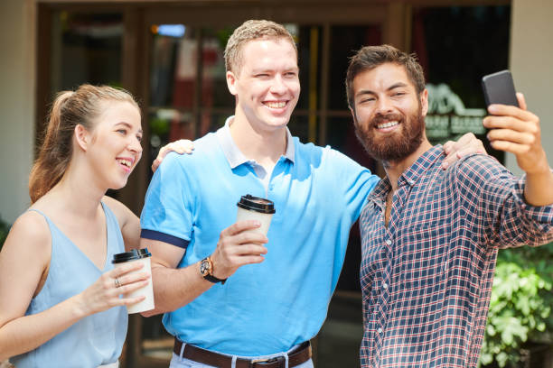 istock Businessman taking selfie with colleagues 1172225514