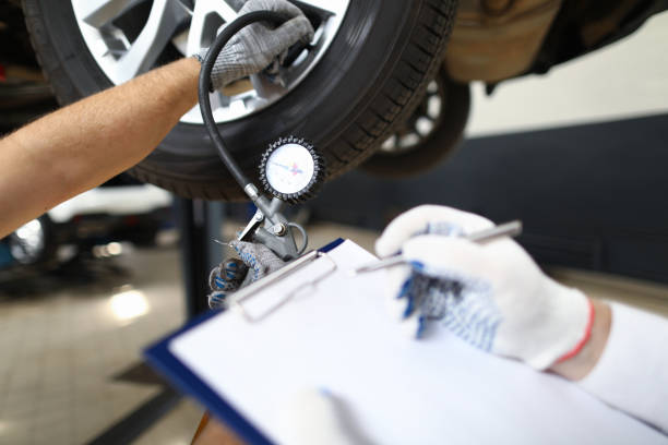 istock Serviceman inspects a pre-sale vehicle against 1172225683