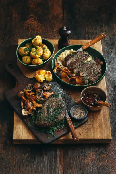 Photo of Steak with wild mushrooms, quinoa, lingonberry sauce and grilled vegetables