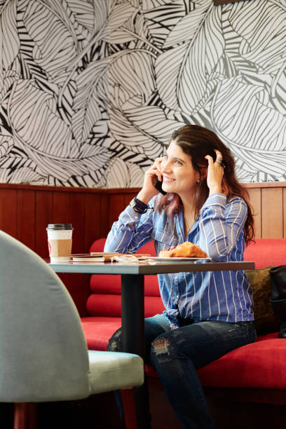 istock Woman scratching head and calling on phone 1172226409