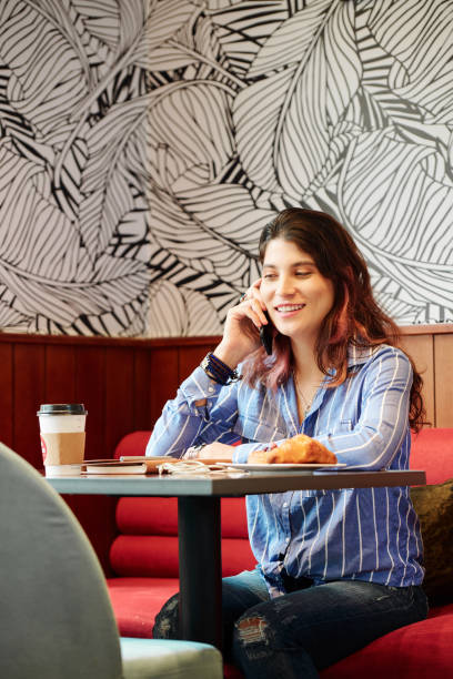 istock Young woman calling friend 1172226424