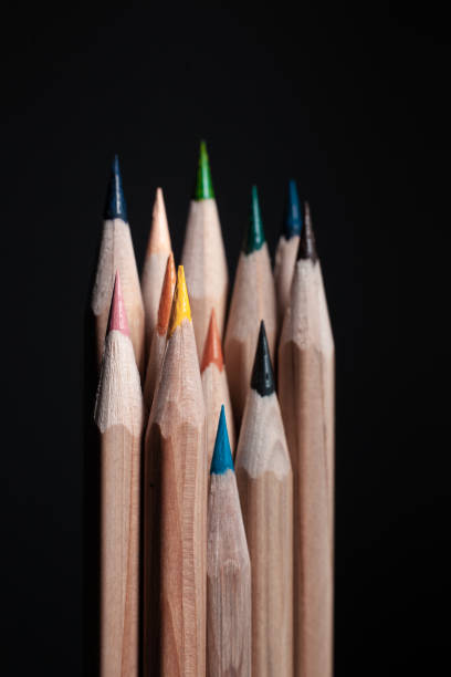 istock Different color pencils isolated on black background 1172229228