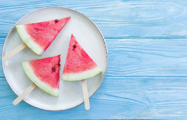 istock watermelon piece on a plate on a wooden background 1172229640
