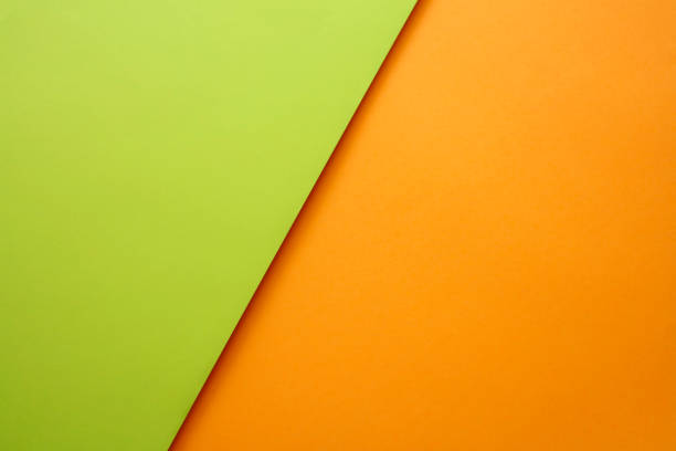 Abstract geometricpaper background in green and orange colors Abstract geometricpaper background in green and orange colors avenida diagonal stock pictures, royalty-free photos & images