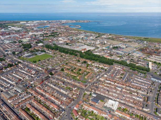 Aerial photo of the UK town of Hartlepool in County Durham, England showing rows of houses, roads and the ocean in the background. Aerial photo of the UK town of Hartlepool in County Durham, England showing rows of houses, roads and the ocean in the background. hartlepool photos stock pictures, royalty-free photos & images