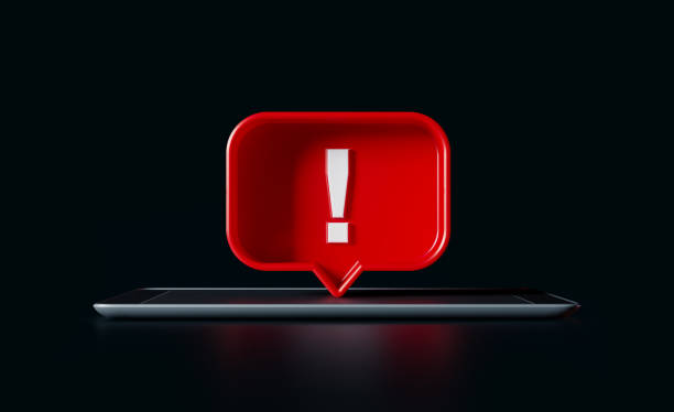 istock Speech Bubble Shaped Red Button with Exclamation Point and A Digital Tablet on Black Background 1172231958