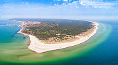 Hel Peninsula - aerial panorama. Helium beaches and the city in the distance. Seascape with a hazy horizon.