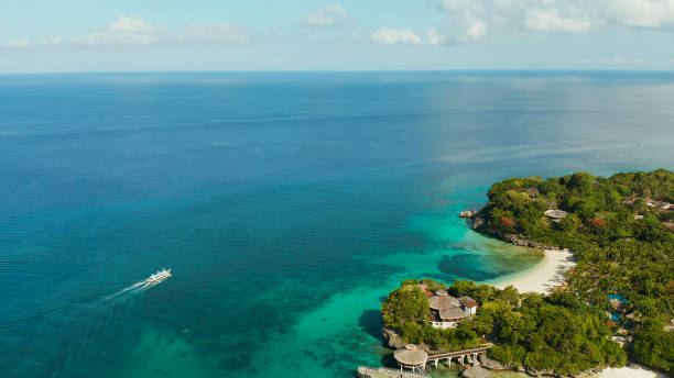 istock Tropical landscape, blue bay and boat 1172234519