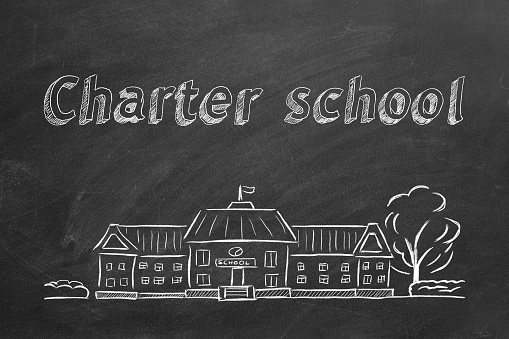 School building  and lettering Charter school on blackboard. Hand drawn sketch.