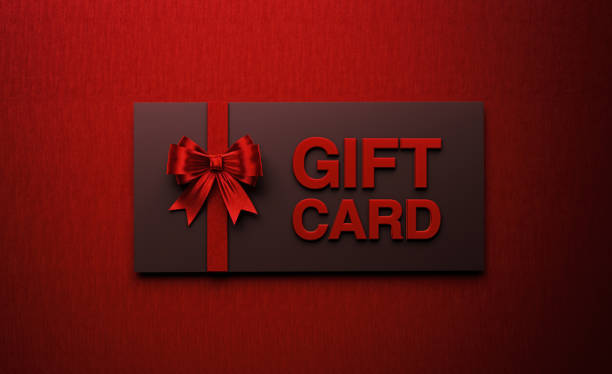 istock Black Gift Card Tied with Red Bow Tie on Red Background 1172238558