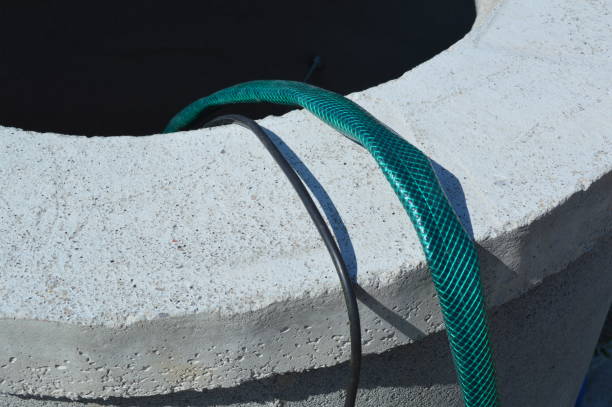 istock Installing a vibration pump in a water well 1172245339