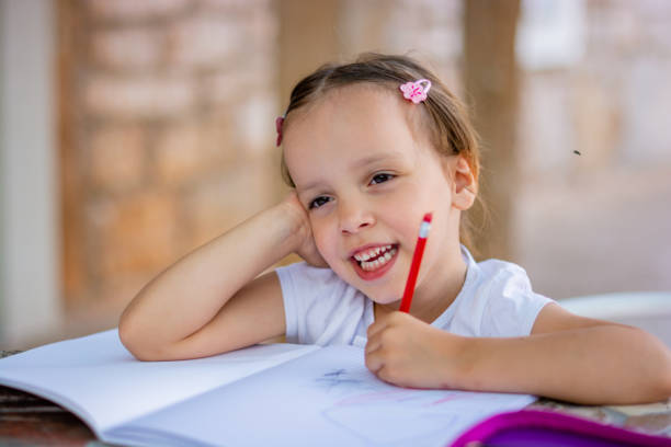 istock Child girl drawing at home. 1172246322