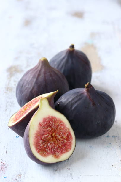 istock Fig fruit on a white wooden background 1172246360
