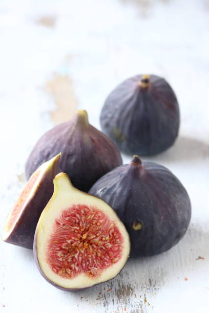 istock Fig fruit on a white wooden background 1172246364