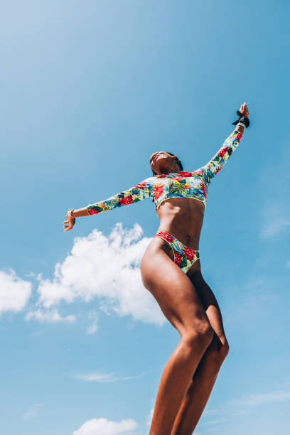 istock Young Black woman at tropical beach 1172246420