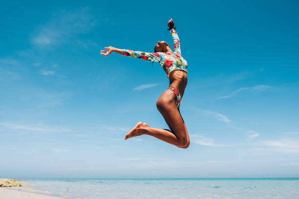 istock Young Black woman at tropical beach 1172246497