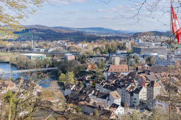Cityscape of Brugg Ost with Mühlimatt Turnhalle, Kloster Königsfelden, residential,  commercial districts, historic old town, Salzhaus  and the casino bridge for vehicles. Picture taken from Hexenplatz.