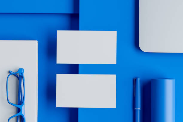 istock Two blank business cards on blue office table 1172250282