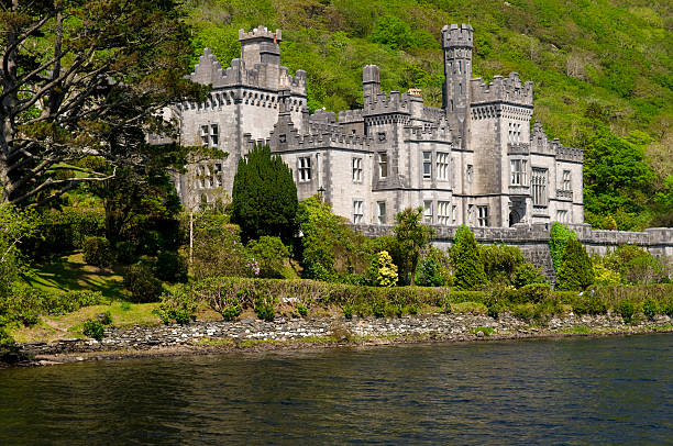 Kylemore Abbey Landscape Kylemore Abbey is the oldest of the Irish Benedictine Abbeys. The Community of nuns, who have resided here since 1920, have a long history stretching back almost three hundred and forty years. kylemore abbey stock pictures, royalty-free photos & images
