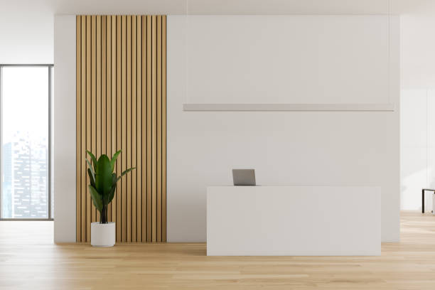 istock White and wooden office interior with reception 1172251689