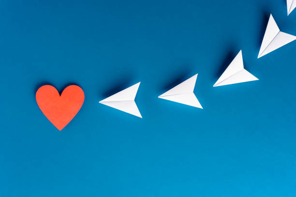 istock Focus, assertiveness, work yourself concept. Flying paper planes origami with heart shape on blue background. Business and solution concept. 1172256269