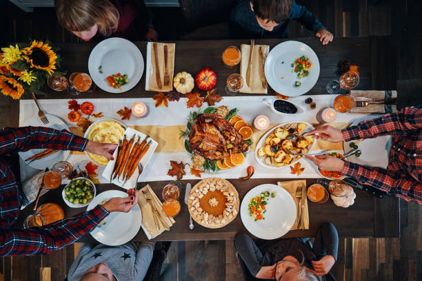 istock Family Having Traditional Holiday Stuffed Turkey Dinner 1172259794