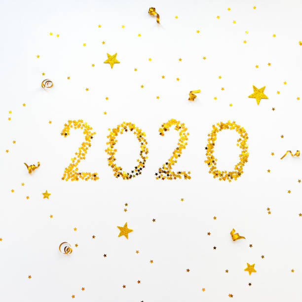 istock New 2020 Year golden star shaped confetti background. 1172260624