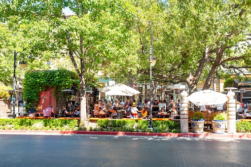 San Jose, California, United States - August 31, 2019:  People dine outdoors on a sunny day at Santana Row in the Silicon Valley, San Jose, California, August 31, 2019