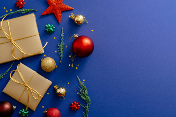 istock Christmas holiday composition. Christmas decorations, presents, baubles on dark blue background with copy space. Banner mockup, postcard. Flat lay, top view, overhead. Winter holiday, Xmas concept. 1172269671