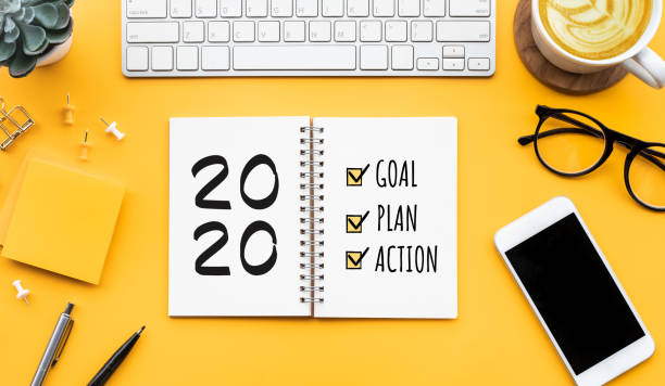 istock 2020 new year goal,plan,action text on notepad with office accessories.Business motivation,inspiration concepts 1172270549