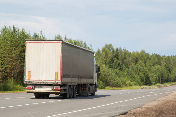 istock Cargo trailer in the summer goes on the highway. 1172272789