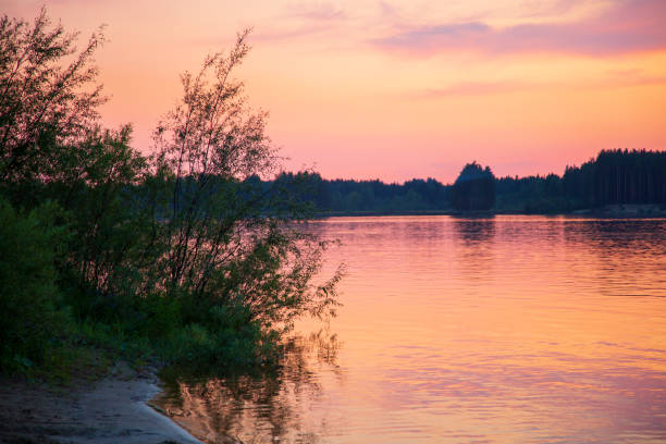 Beautiful summer landscape with sunset on the river.