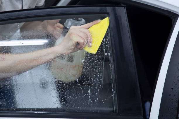 istock Install windows film on the car. 1172275508