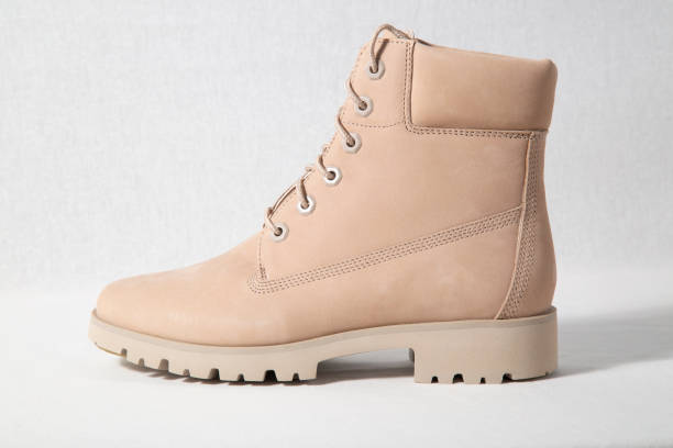 istock Winter brown leather boots on white background. 1172277503