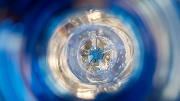 istock Long background with a plastic blue bottle with water drops inside 1172277605