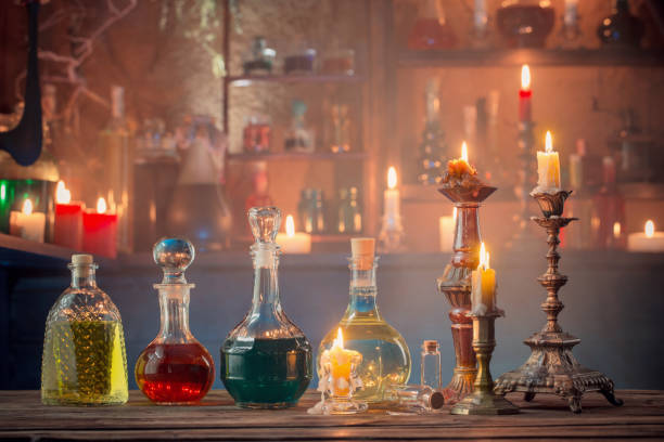 istock magic potions in bottles on wooden background 1172278103
