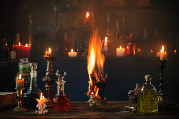 istock old burning paper with potions on old wooden table 1172278133