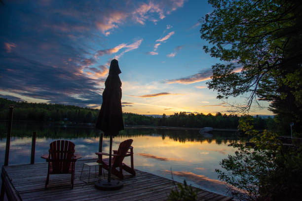istock Two lake chairs on a dock in Canada 1172278138