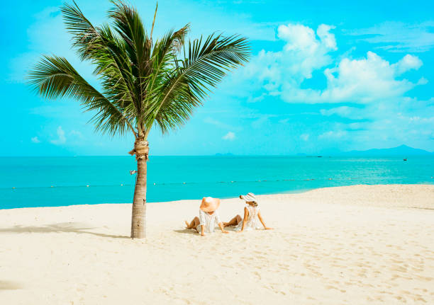 istock Cuople woman at tropical beach 1172279266