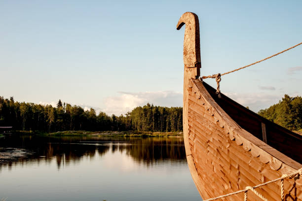 istock Rest zone. Blue water in a forest lake with pine trees. The forest is reflected in the water. 1172279896