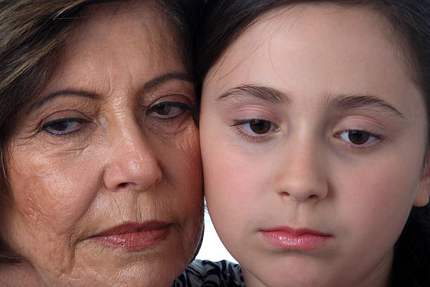 istock Grandmother and granddaughter sad 117228131
