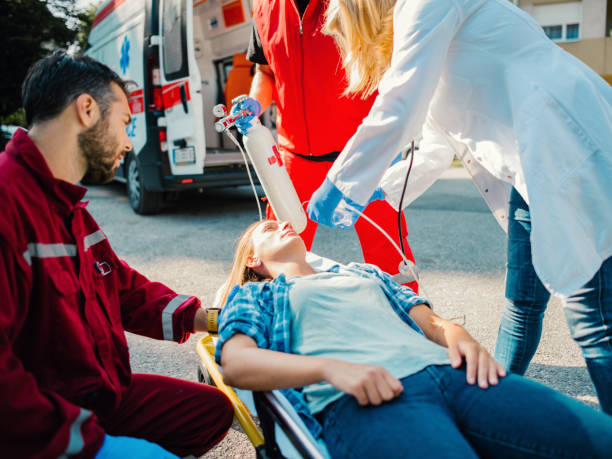istock Doctor and paramedics helping woman 1172281672
