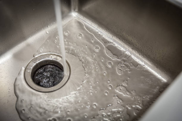 istock Stainless kitchen sink with food waste disposal in modern home 1172282073