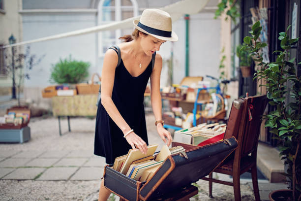 istock Woman is choosing books in a bookstore 1172283111