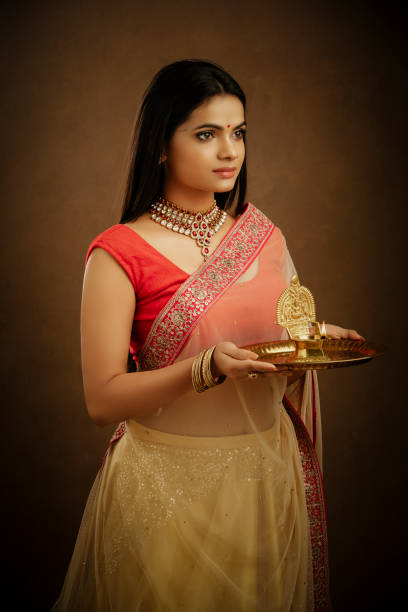 istock Hindu Indian young women praying with Deepa 1172283866