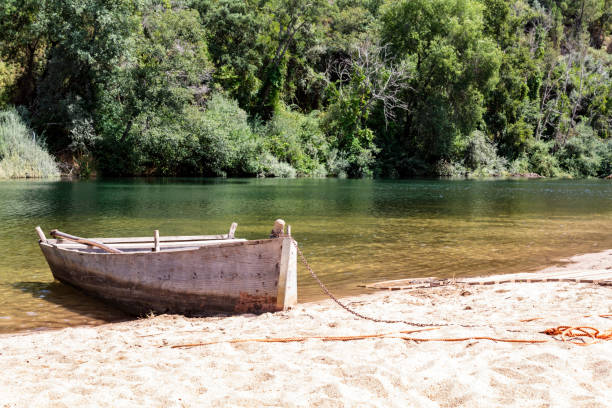 istock Wooden boat moored by the river 1172285315